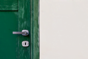 silver lock on a green door